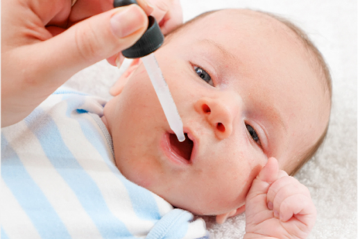 A child receiving a vaccination shot in the arm from a healthcare professional